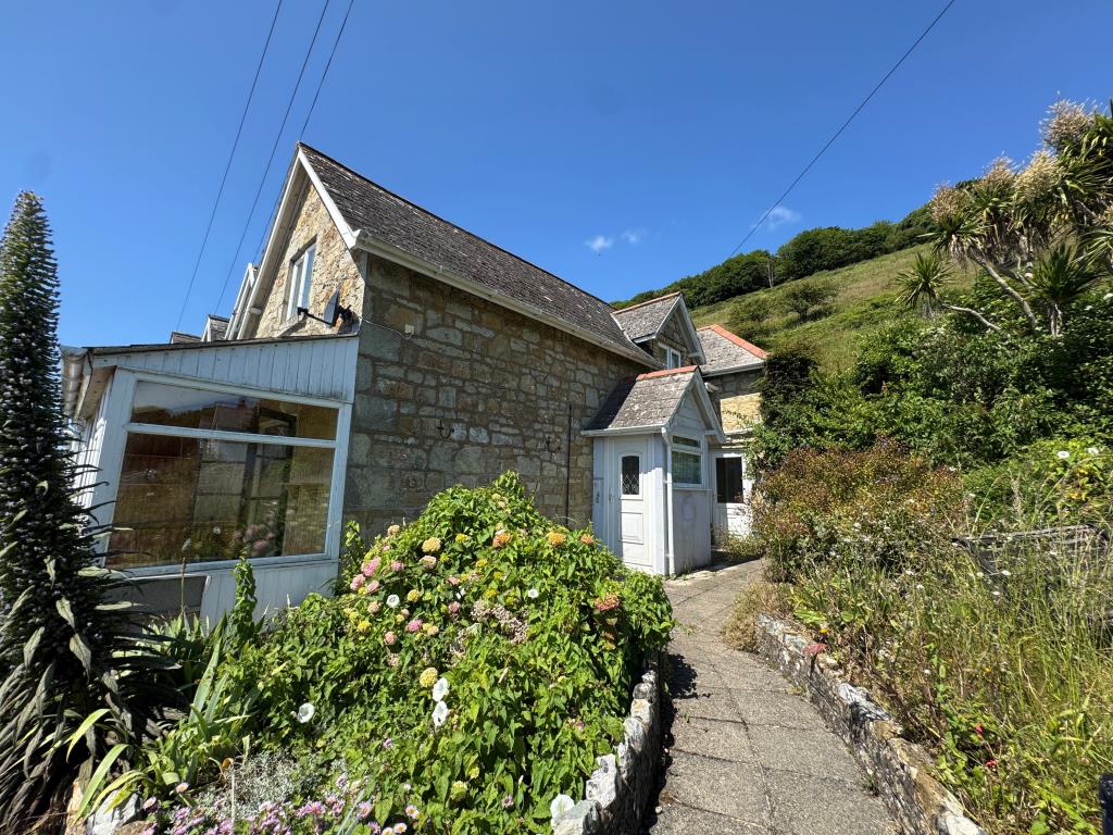 Lot: 147 - COTTAGE FOR IMPROVEMENT WITH SEA VIEWS - Looking at the Front From Inside the Front Garden